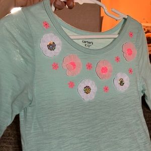 Fun spring/summer girls dress in a light turquoise with peach and white flowers!